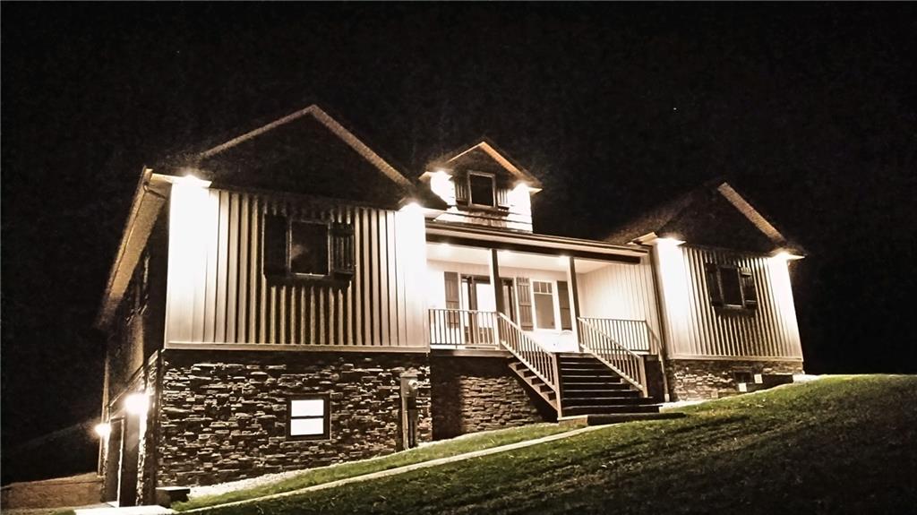 320 Highway 31 Ruffs Dale, PA 15679 - Photo 1 of 19 a front view of a house with a yard