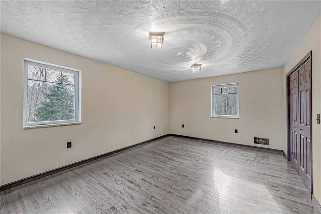 320 Highway 31 Ruffs Dale, PA 15679 - Photo 8 of 19 wooden floor in an empty room with a window
