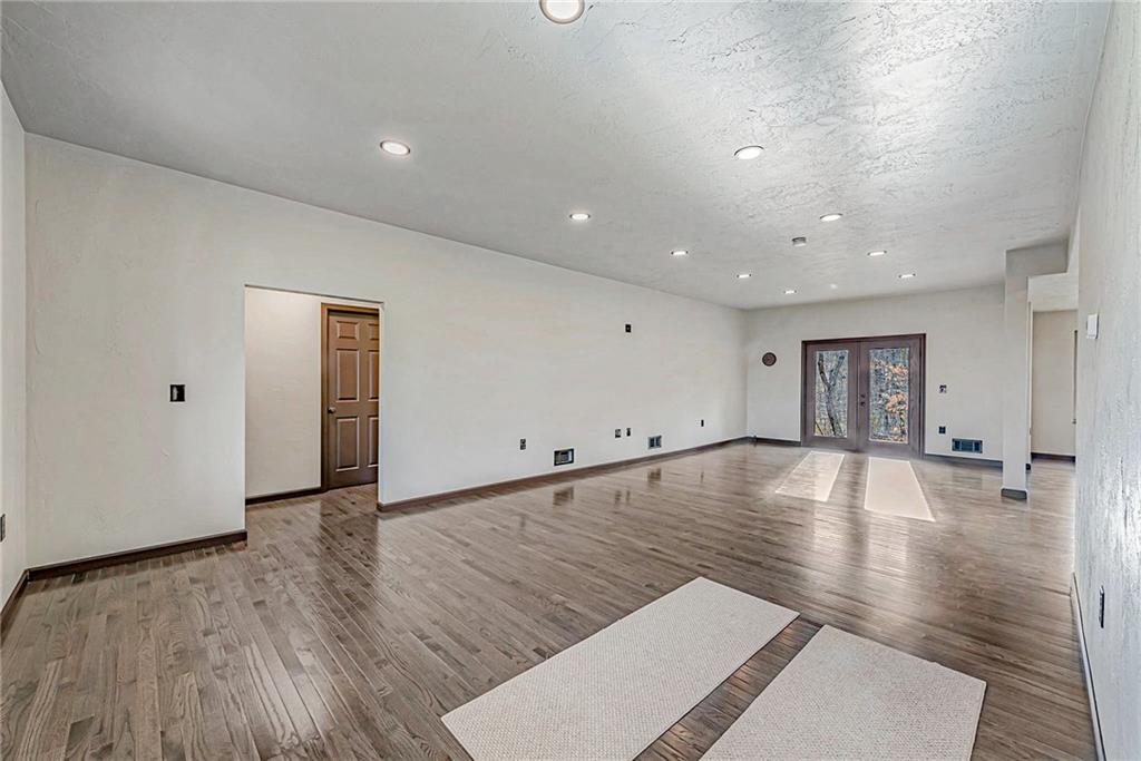 320 Highway 31 Ruffs Dale, PA 15679 - Photo 9 of 19 a view of an empty room with wooden floor and a window