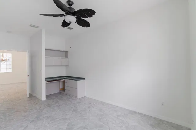 a very nice looking dining room with a table and chairs