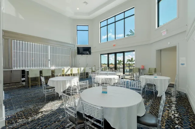 an aerial view of residential houses with outdoor space and swimming pool