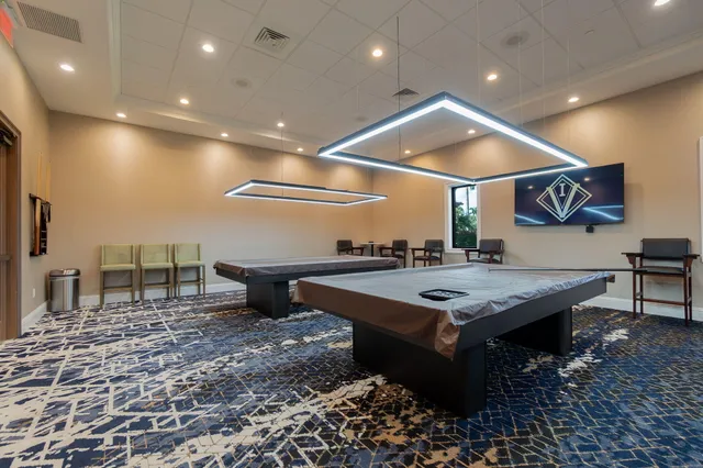 an aerial view of a house with outdoor space