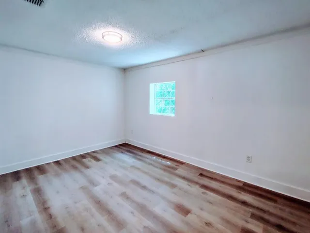 a view of a room that has a window in it