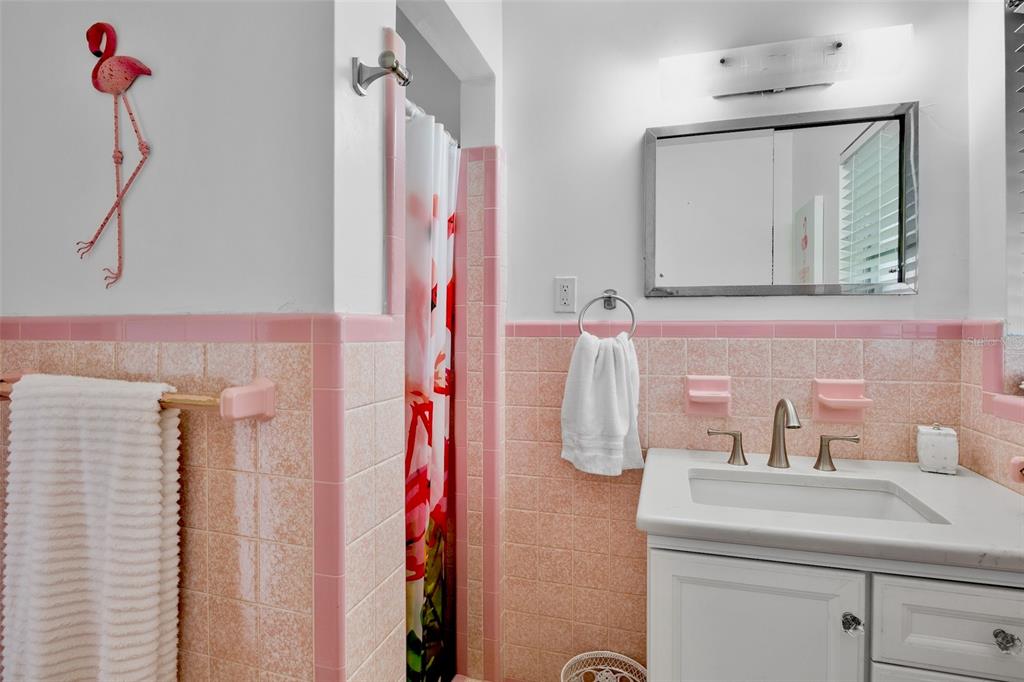 223 Roberts Road Nokomis, FL 34275 - Photo 18 of 27 a bathroom with a sink and mirror