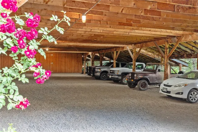 a front view of house with a garden and trees