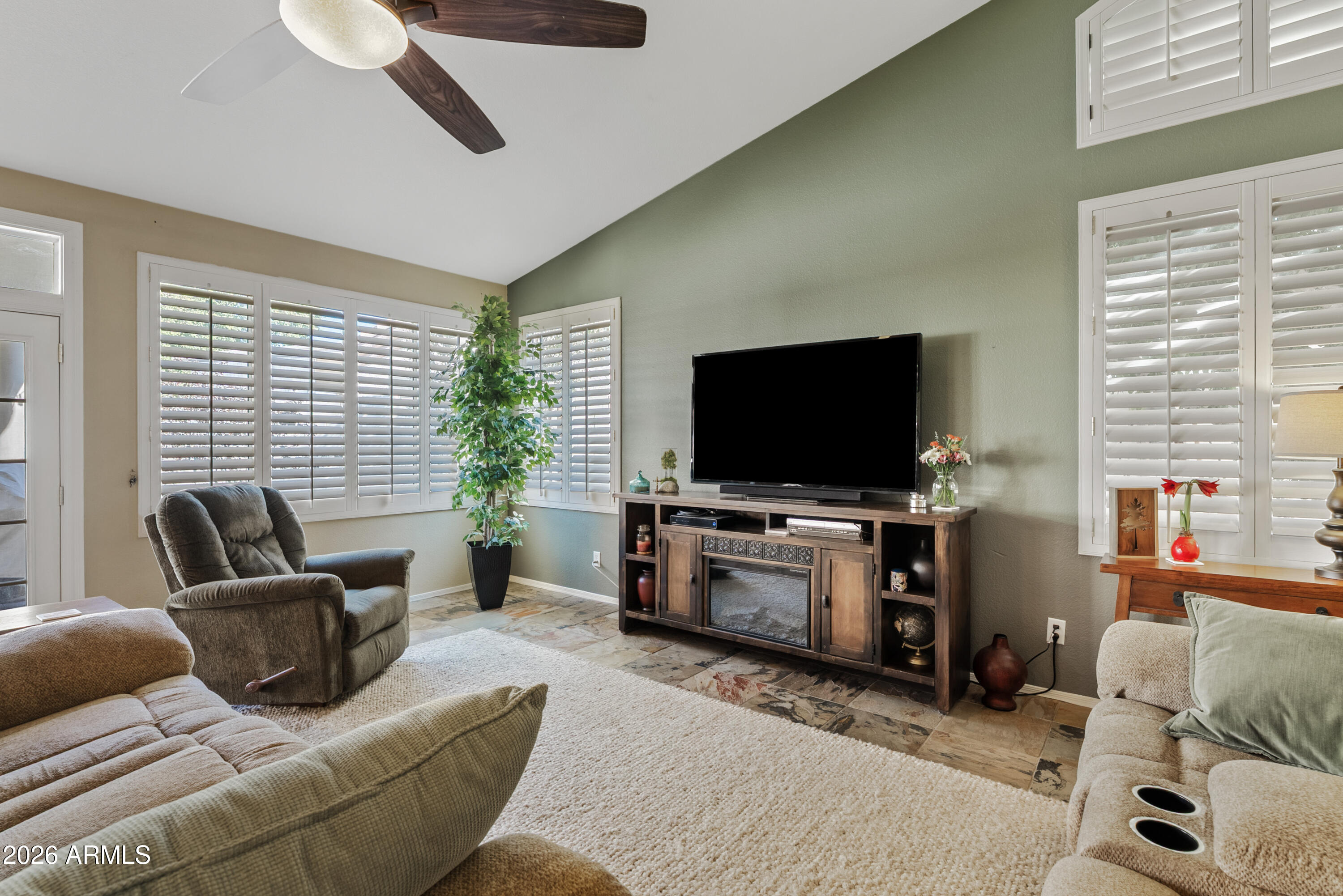 550 South Oak Street Gilbert, AZ 85233 - Photo 12 of 41 a living room with furniture and a flat screen tv