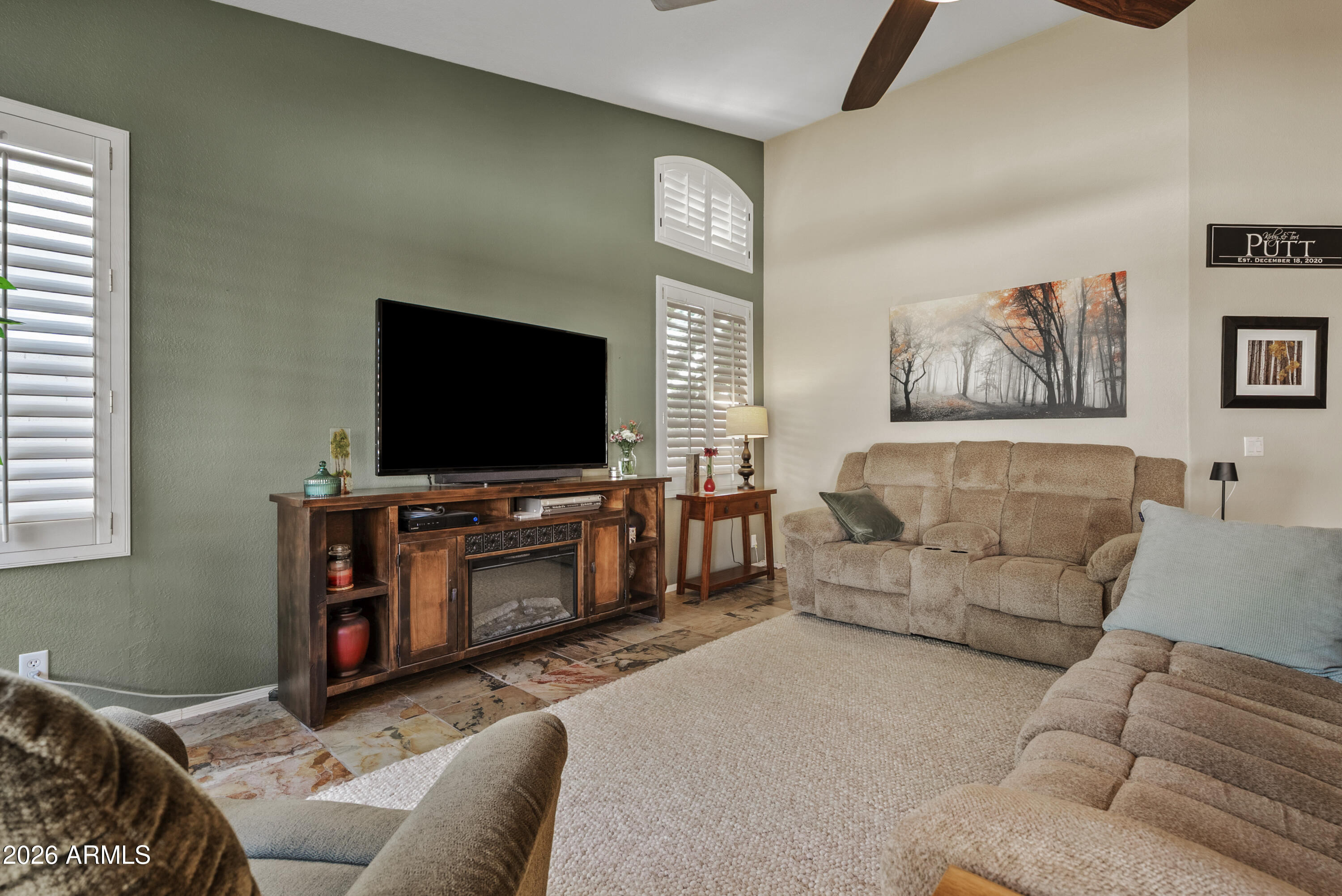 550 South Oak Street Gilbert, AZ 85233 - Photo 13 of 41 a living room with furniture and a flat screen tv