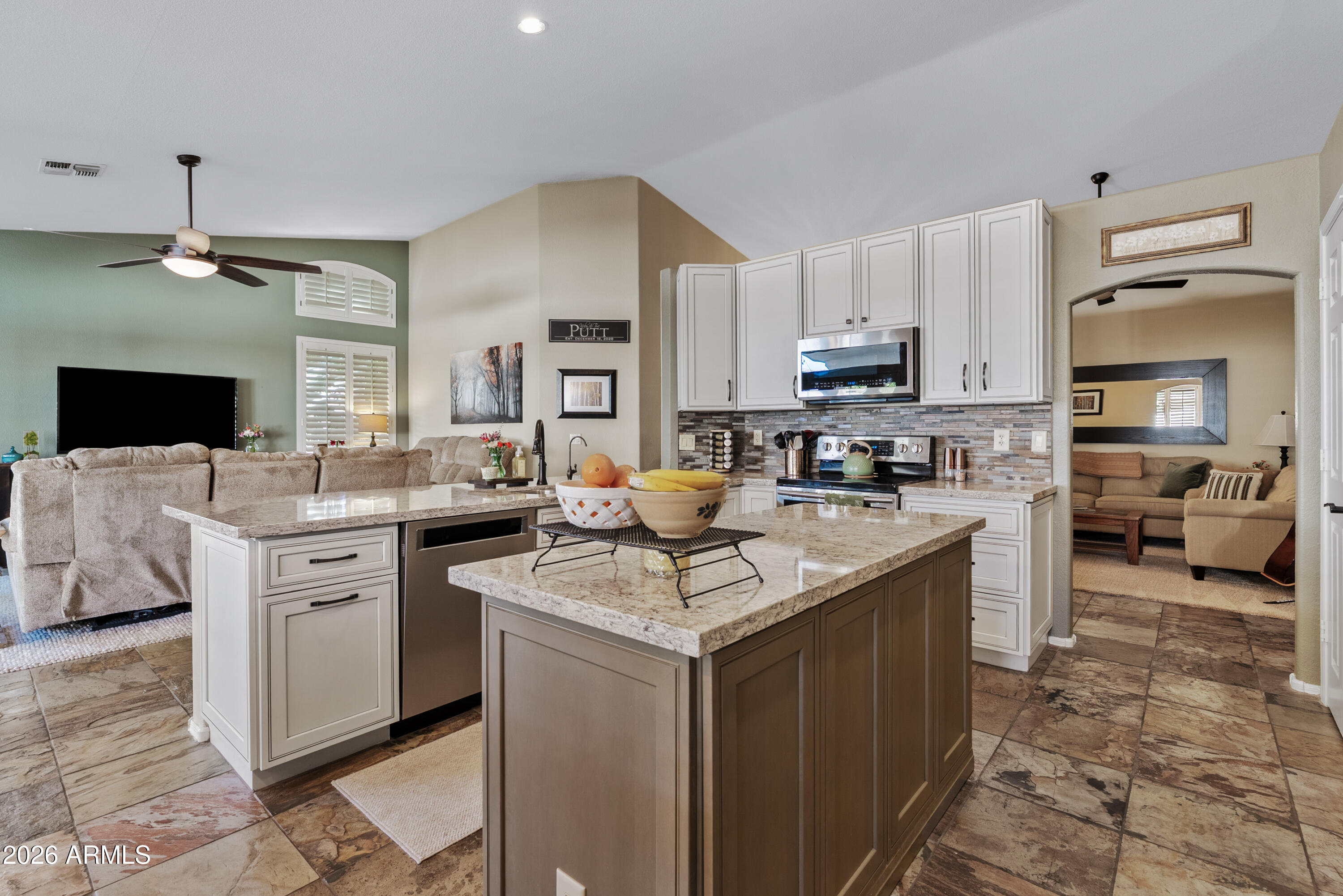 550 South Oak Street Gilbert, AZ 85233 - Photo 18 of 41 a kitchen with stainless steel appliances granite countertop a sink stove and refrigerator
