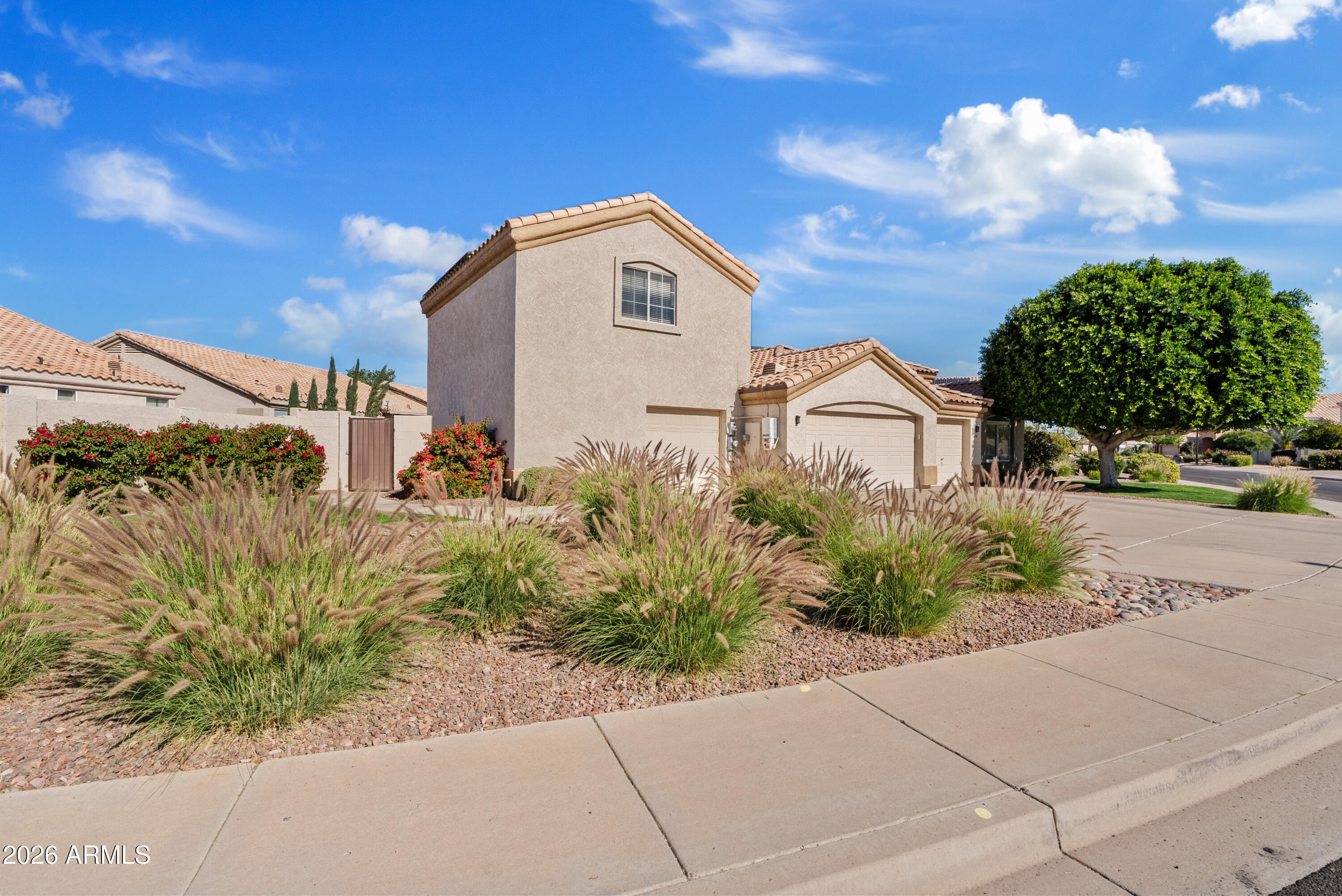 550 South Oak Street Gilbert, AZ 85233 - Photo 2 of 41 a aerial view of a house with a yard and potted plants