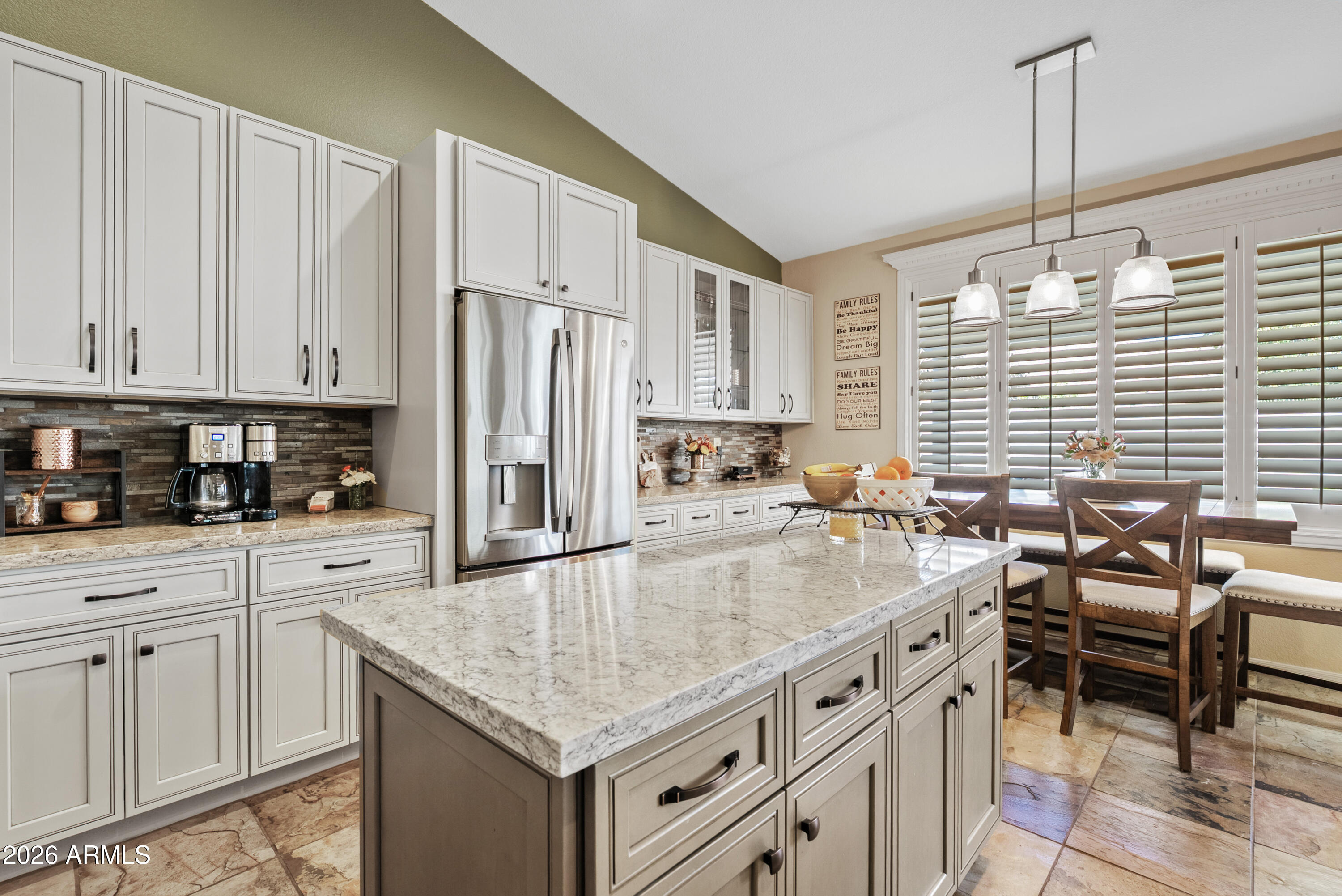 550 South Oak Street Gilbert, AZ 85233 - Photo 21 of 41 a kitchen with stainless steel appliances granite countertop a white cabinets and a stove