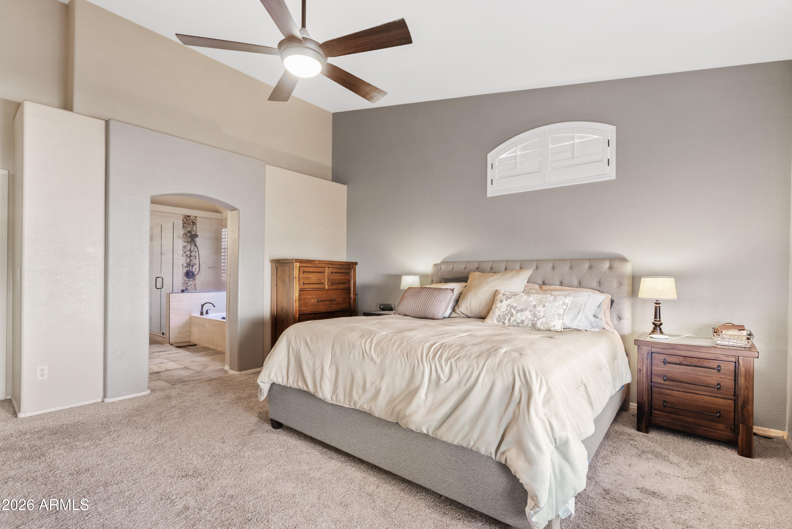 550 South Oak Street Gilbert, AZ 85233 - Photo 23 of 41 a bedroom with a bed and a chandelier