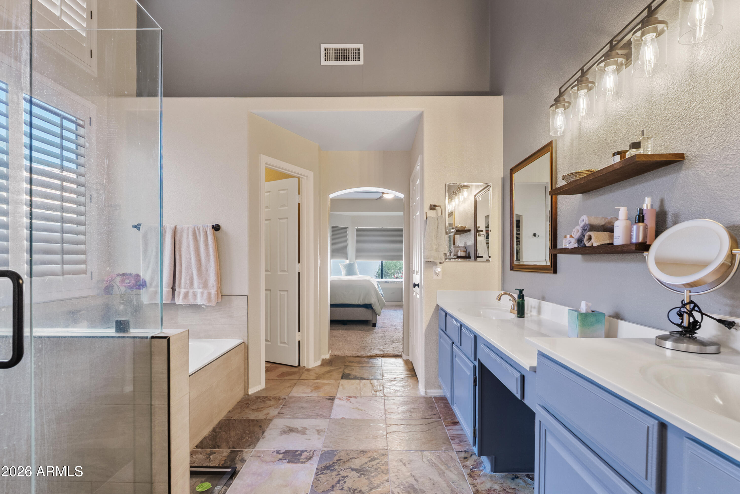 550 South Oak Street Gilbert, AZ 85233 - Photo 27 of 41 a large bathroom with a double vanity sink a mirror and a shower