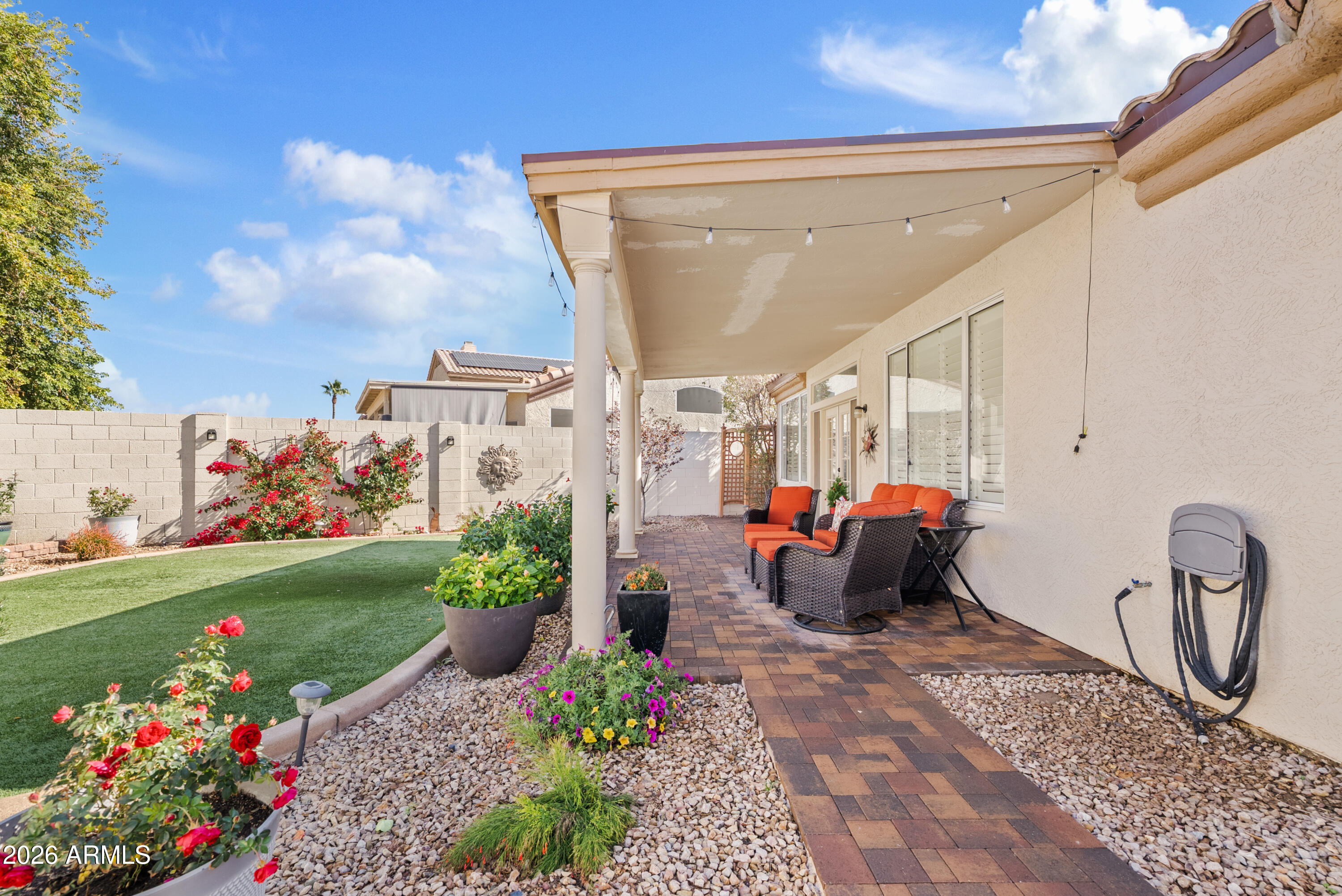 550 South Oak Street Gilbert, AZ 85233 - Photo 29 of 41 a bench is sitting in middle of flowers