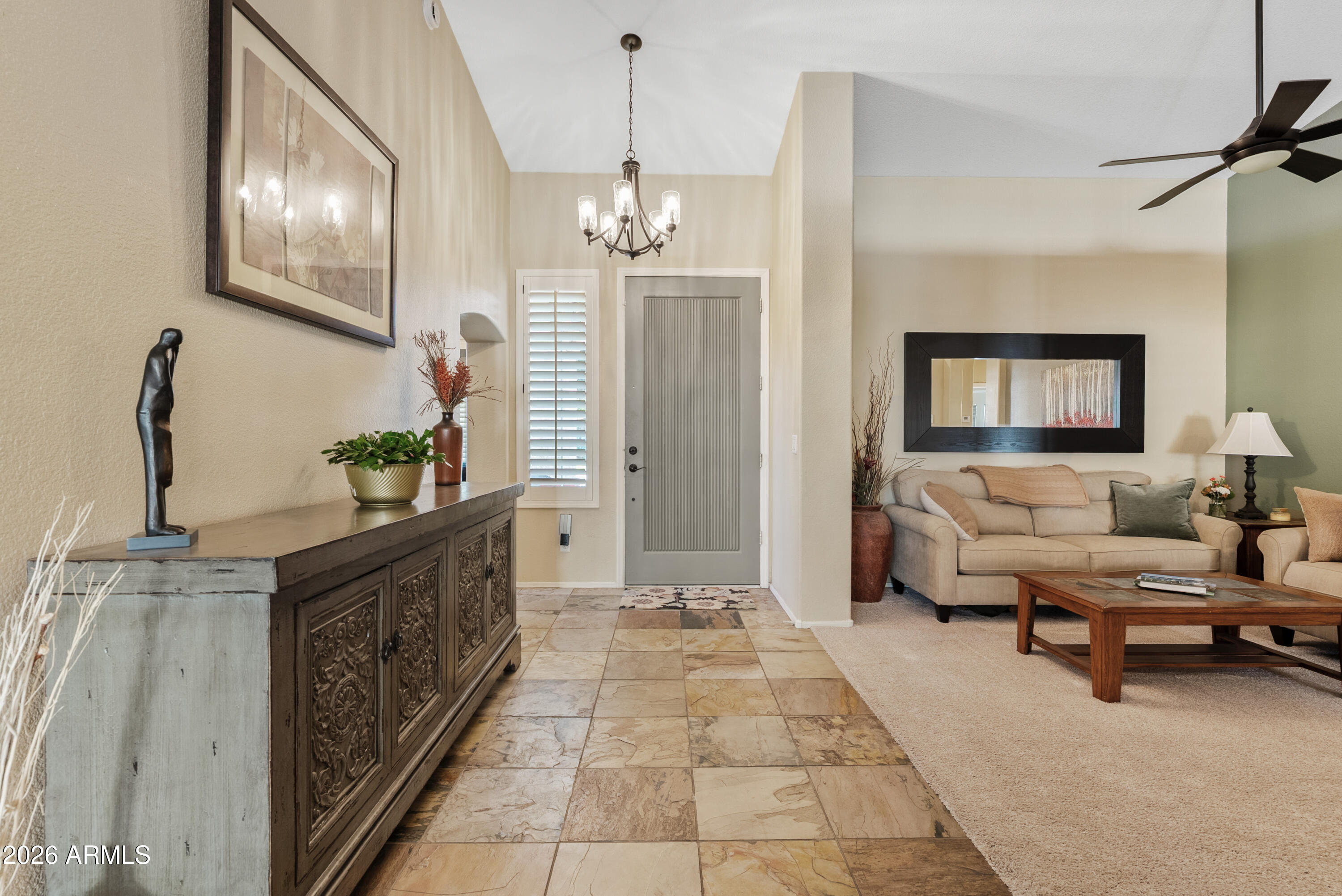 550 South Oak Street Gilbert, AZ 85233 - Photo 3 of 41 a living room with furniture a chandelier and a chandelier
