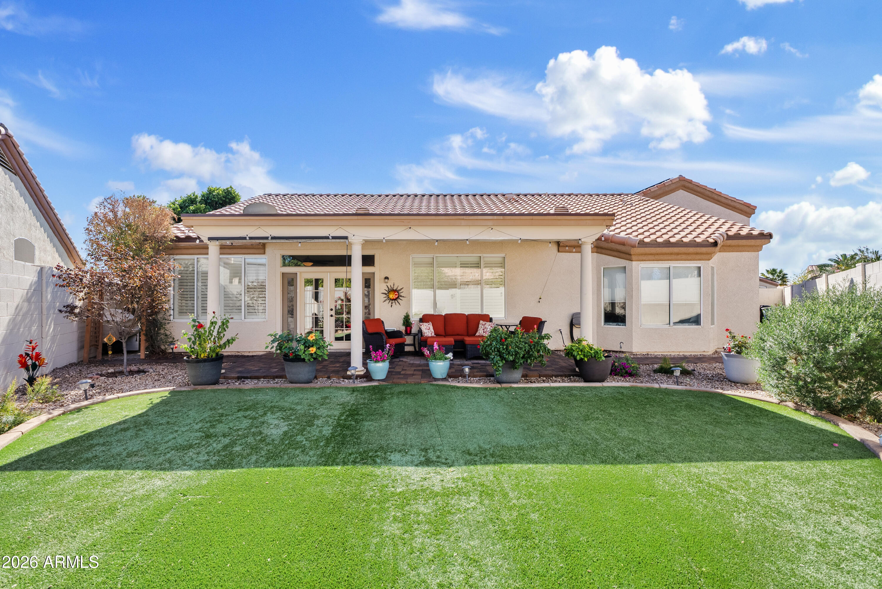 550 South Oak Street Gilbert, AZ 85233 - Photo 32 of 41 a front view of a house with a garden and plants