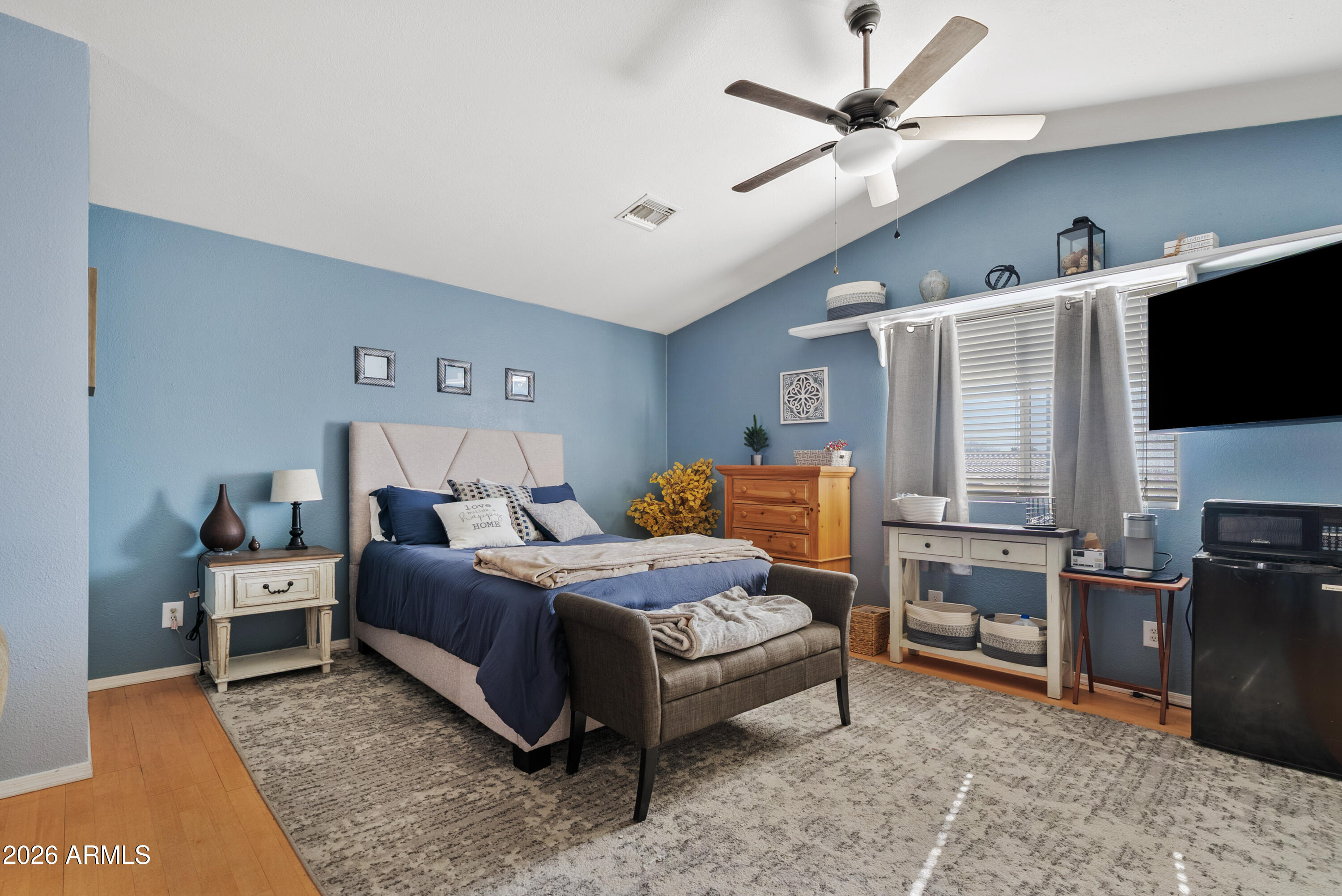 550 South Oak Street Gilbert, AZ 85233 - Photo 37 of 41 a bedroom with a bed and a flat screen tv