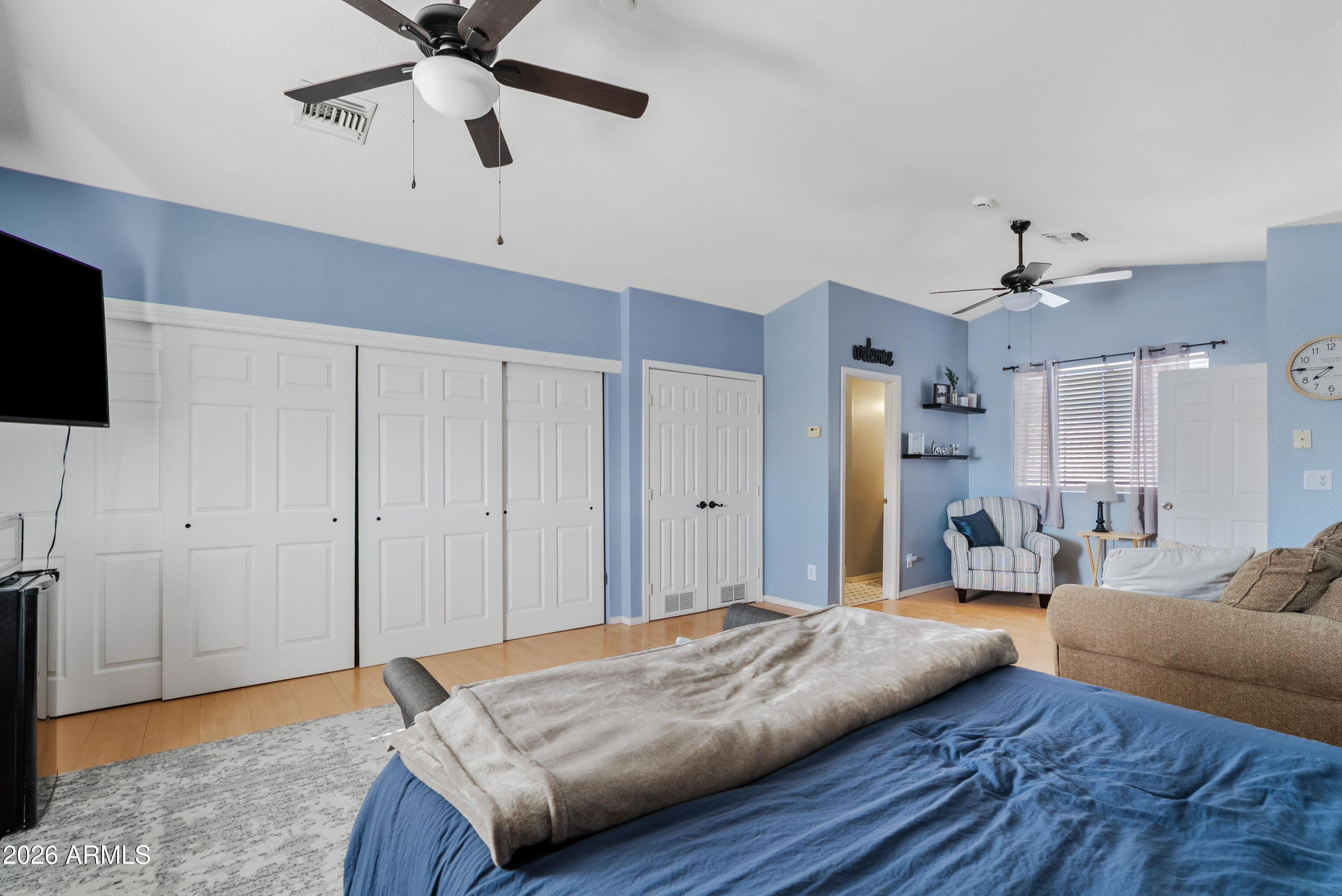 550 South Oak Street Gilbert, AZ 85233 - Photo 39 of 41 a bedroom with a bed window and a flat screen television