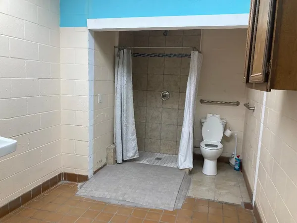 a bathroom with a sink and toilet