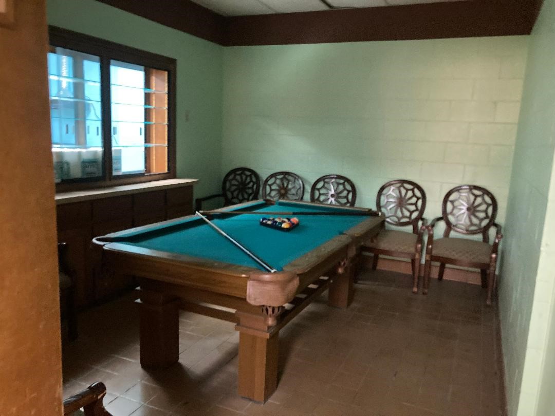 11001 Fondren Road, Unit A Houston, TX 77096 - Photo 5 of 15 a room with furniture pool table and windows
