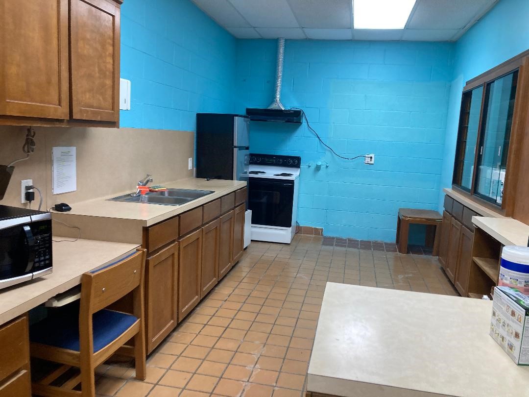 11001 Fondren Road, Unit A Houston, TX 77096 - Photo 7 of 15 a kitchen with a sink stove and cabinets