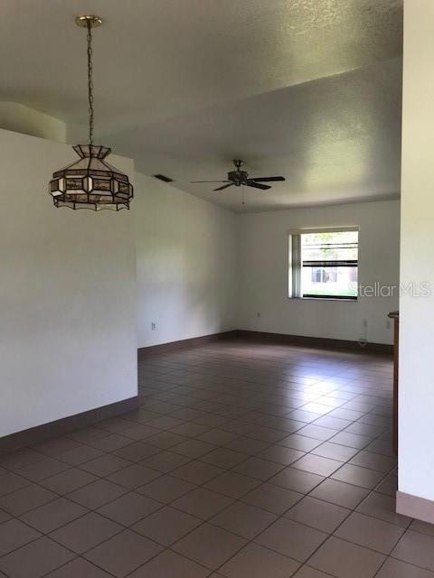 25385 Sandhill Boulevard, Unit E1 Punta Gorda, FL 33983 - Photo 16 of 16 an empty room with a empty space and windows