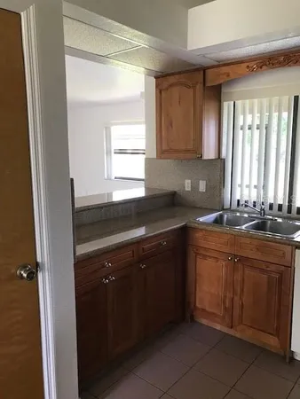 a kitchen with a sink and a window