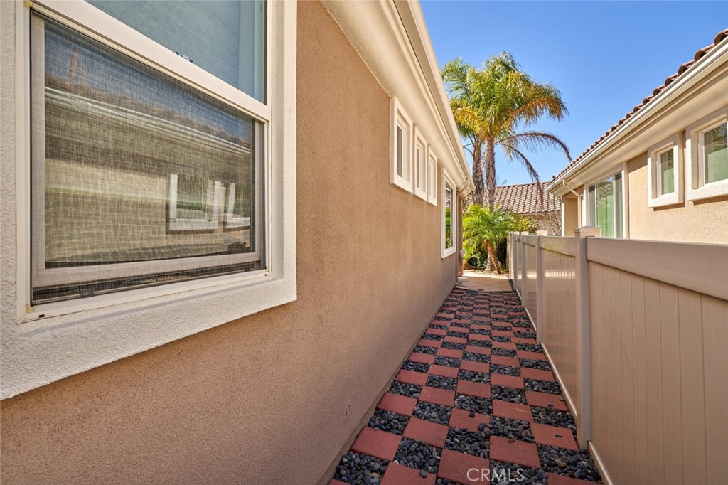 1143 Saguara Road Beaumont, CA 92223 - Photo 19 of 66 a view of a house with a door and a window