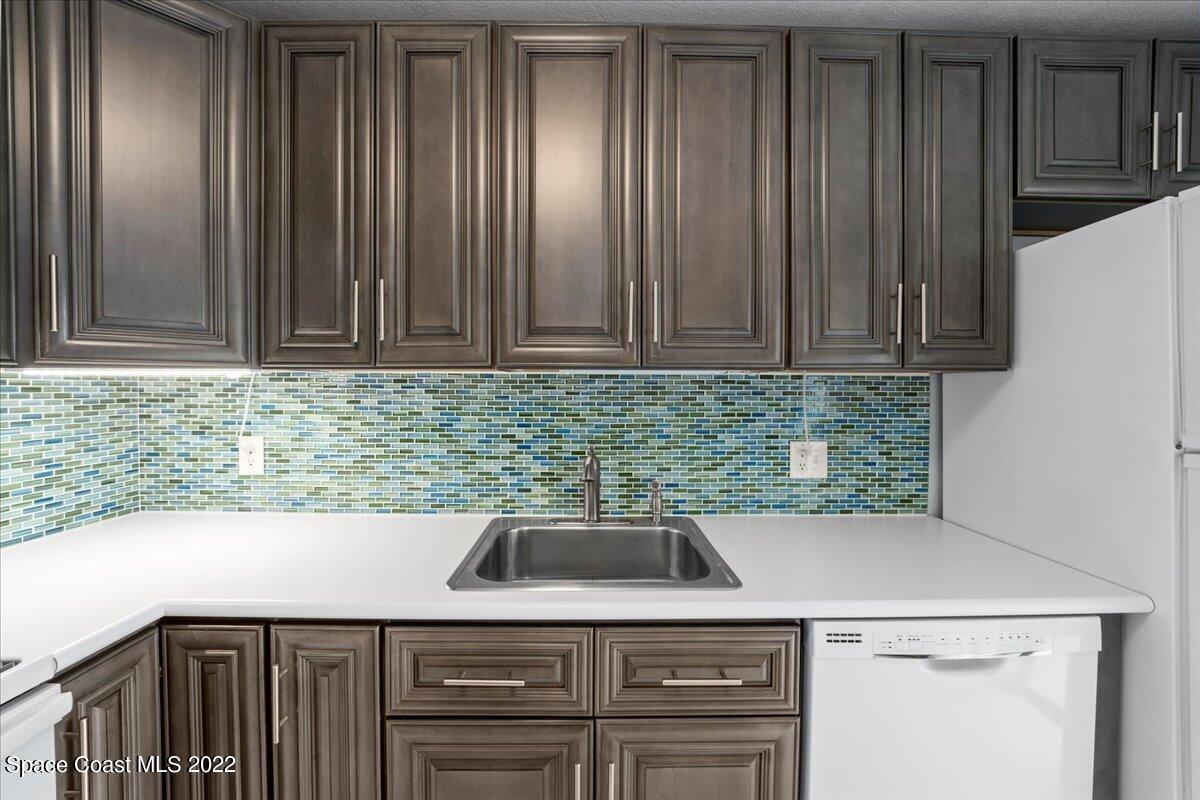 2012 Dan Court Palm Bay, FL 32905 - Photo 13 of 22 a kitchen with a sink and cabinets