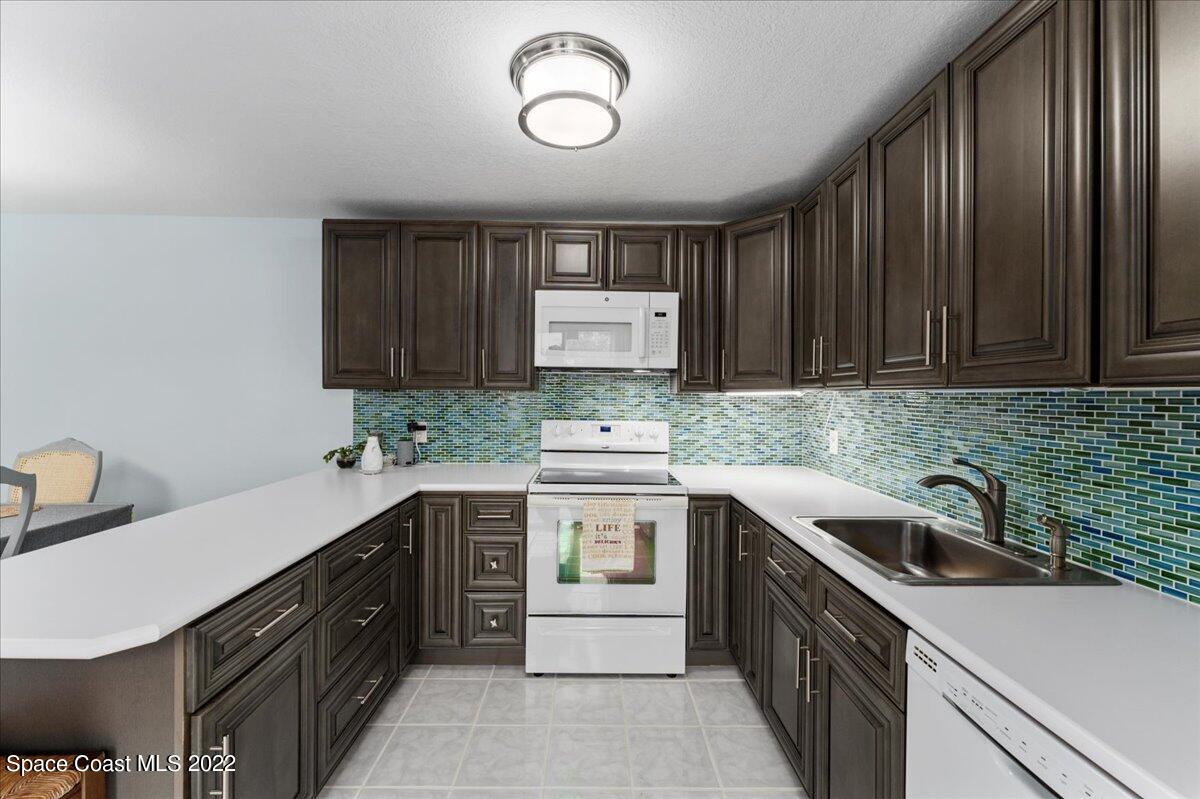 2012 Dan Court Palm Bay, FL 32905 - Photo 14 of 22 a kitchen with a sink cabinets and appliances