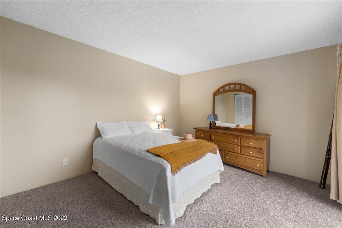 2012 Dan Court Palm Bay, FL 32905 - Photo 16 of 22 a bed room with a bed and dresser