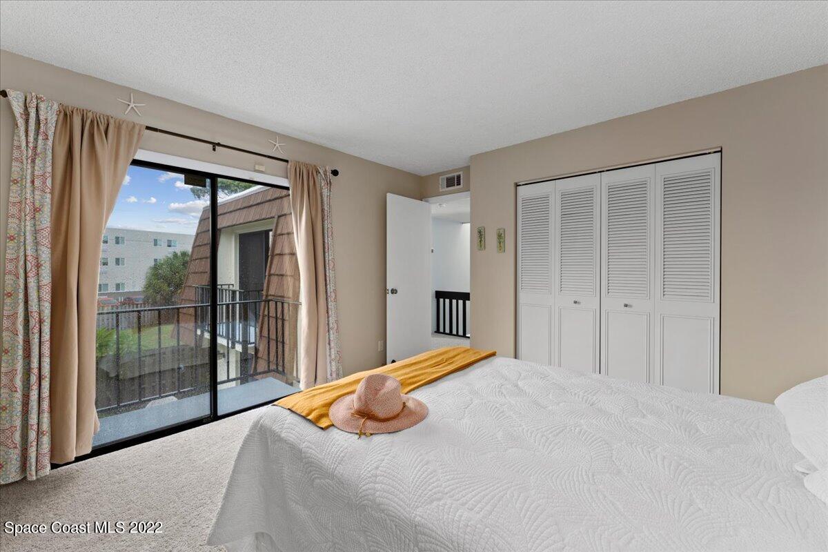 2012 Dan Court Palm Bay, FL 32905 - Photo 17 of 22 a bedroom with a large bed and a large window