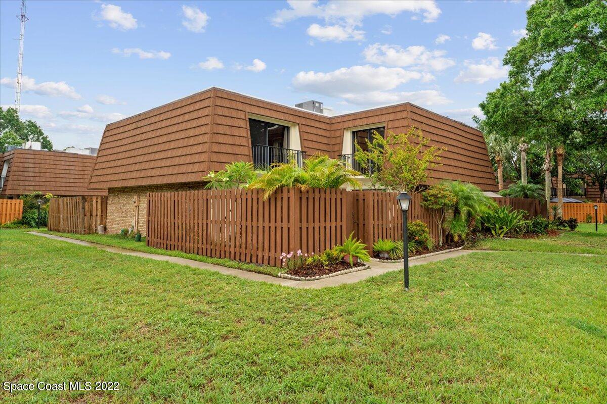 2012 Dan Court Palm Bay, FL 32905 - Photo 2 of 22 a view of a house with backyard and a garden