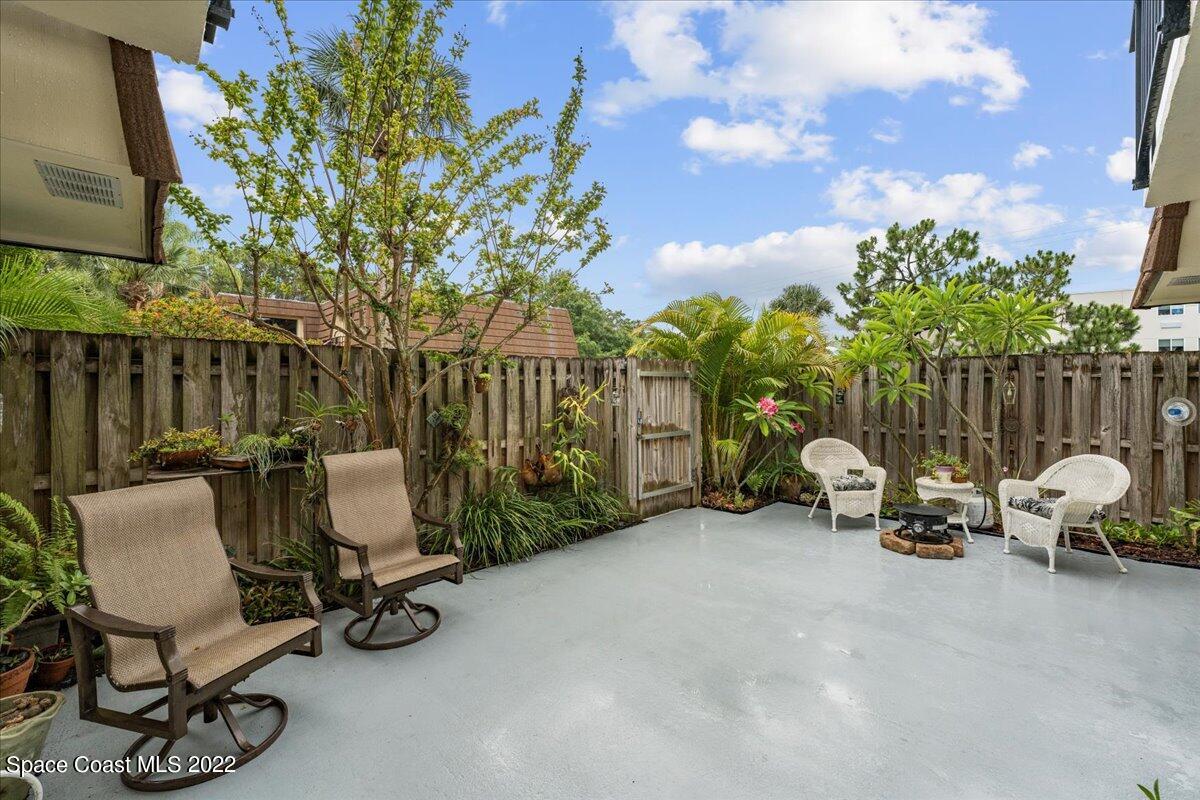 2012 Dan Court Palm Bay, FL 32905 - Photo 6 of 22 a view of a chair and tables in the back yard of the house