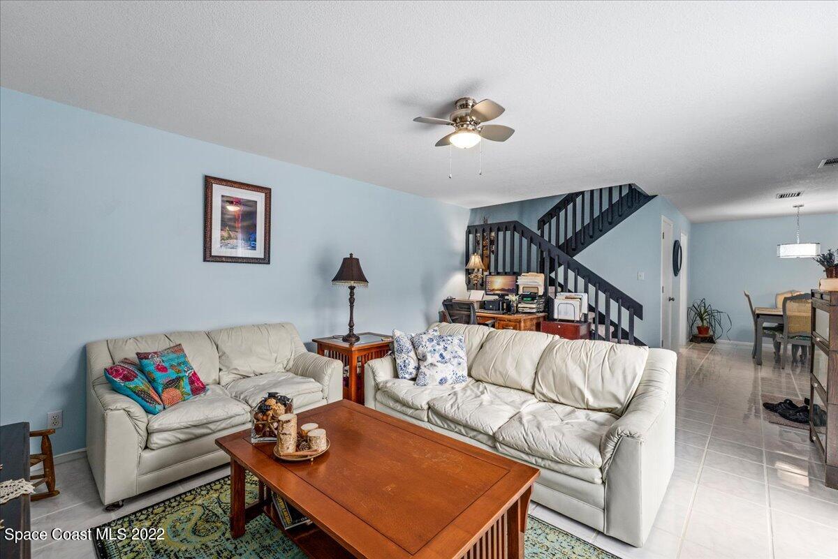 2012 Dan Court Palm Bay, FL 32905 - Photo 9 of 22 a living room with furniture and stairs