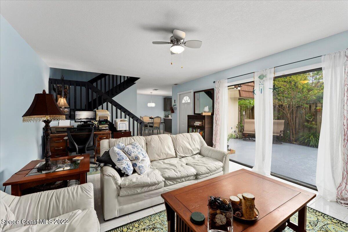 2012 Dan Court Palm Bay, FL 32905 - Photo 10 of 22 a living room with furniture and a ceiling fan