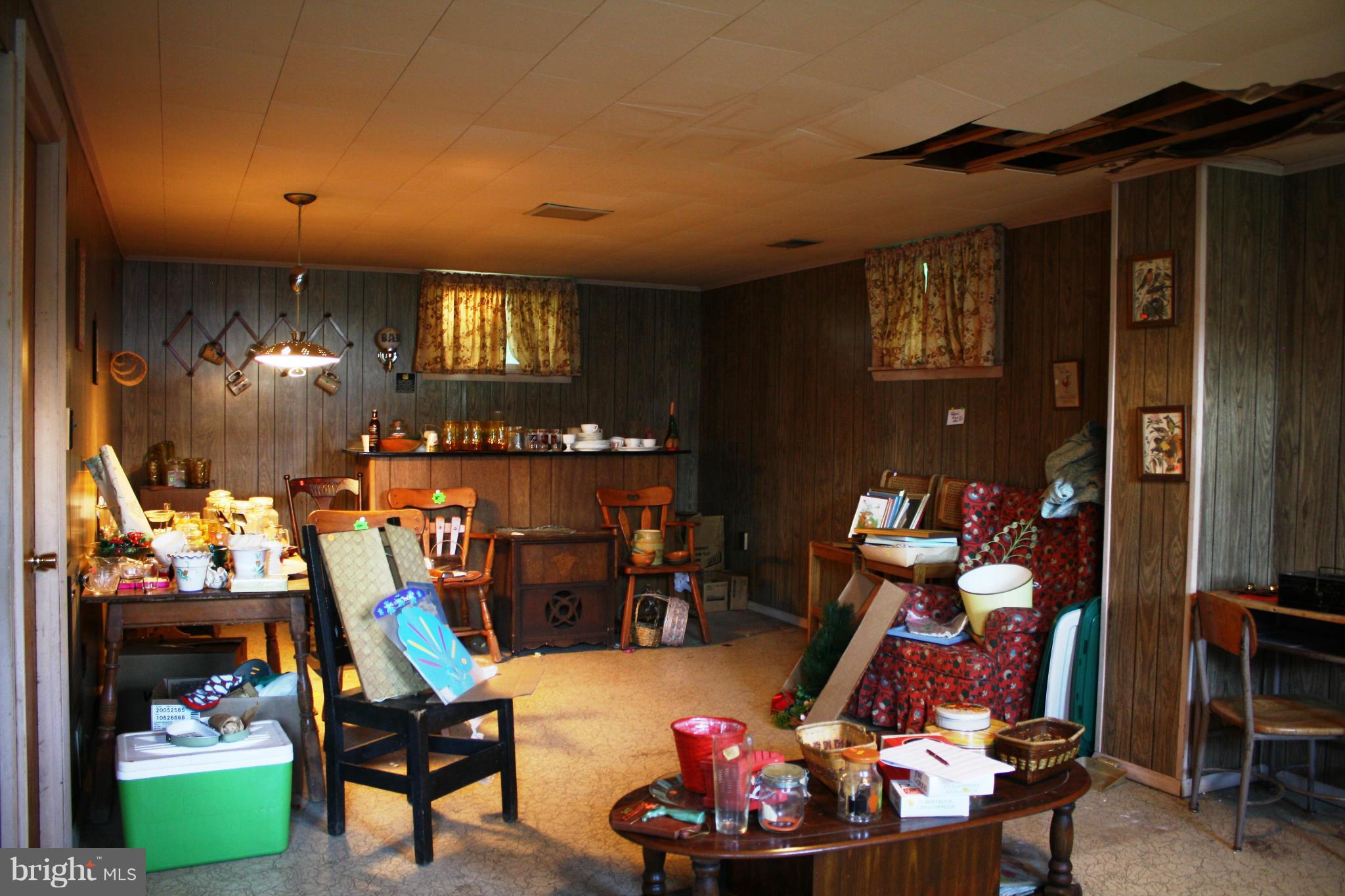 9006 Kilbride Road Baltimore, MD 21236 - Photo 22 of 30 a living room filled with furniture and a fireplace