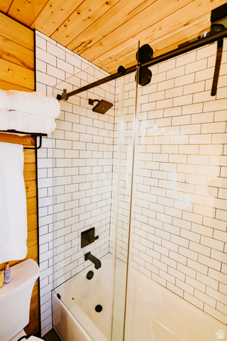 1413 Basel Drive Midway, UT 84049 - Photo 42 of 137 Full bath with wooden ceiling, enclosed tub / shower combo, and wooden walls