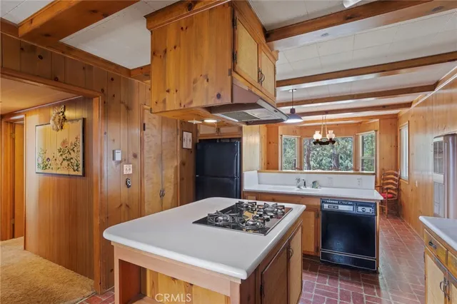 a kitchen with a stove and a refrigerator