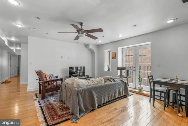 a bedroom with furniture and a wooden floor