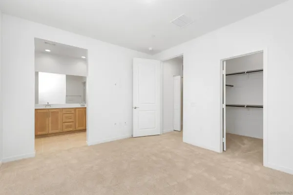 a view of an empty room and fire place