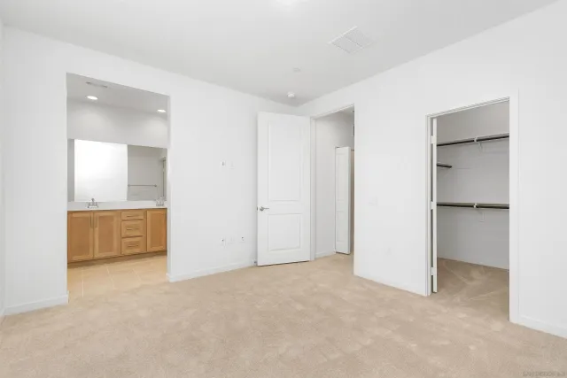 a view of an empty room and fire place