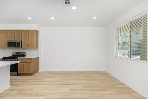 a view of a kitchen with microwave and stove
