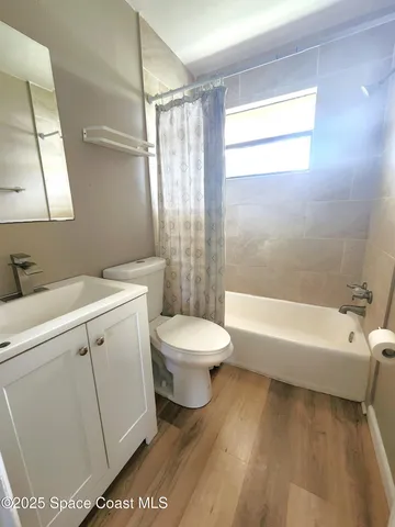 a bathroom with a toilet a sink and a bathtub