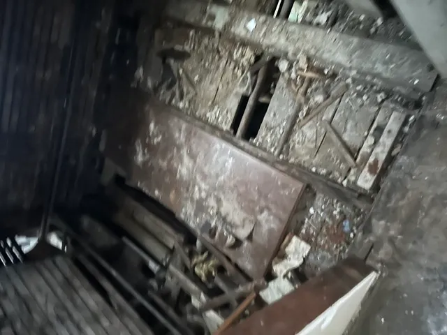 a stove top oven sitting inside of a kitchen