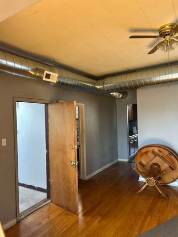 a stove top oven sitting inside of a kitchen