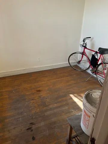 a bathroom with a toilet a sink and a mirror