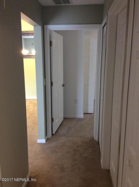7920 Merrill Road, Unit 1009 Jacksonville, FL 32277 - Photo 13 of 22 a view of hallway with closet