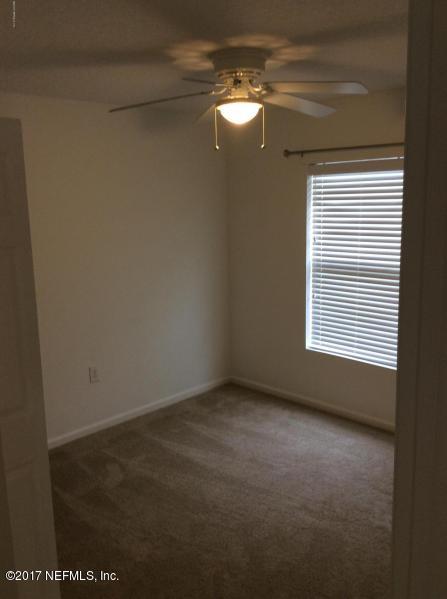 7920 Merrill Road, Unit 1009 Jacksonville, FL 32277 - Photo 14 of 22 a view of empty room with window