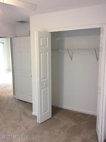 7920 Merrill Road, Unit 1009 Jacksonville, FL 32277 - Photo 15 of 22 a view of closet area