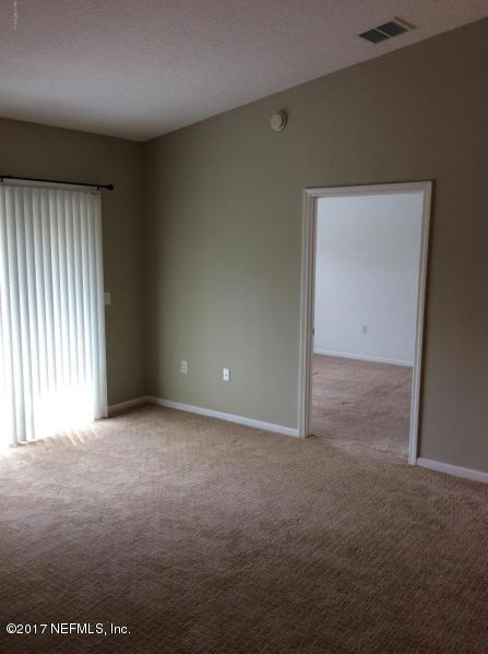 7920 Merrill Road, Unit 1009 Jacksonville, FL 32277 - Photo 16 of 22 an empty room with windows